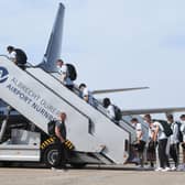 Germany's players and staff board a plane bound for England on the tarmac of Nuremberg Airport.