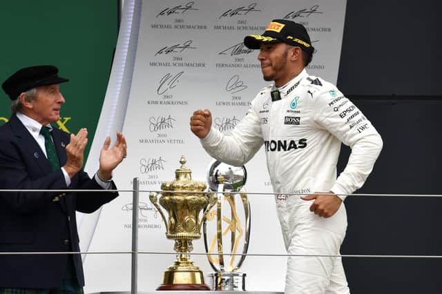 Jackie Stewart applauds Lewis Hamilton's British Grand Prix win in 2017.