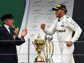 Jackie Stewart applauds Lewis Hamilton's British Grand Prix win in 2017.