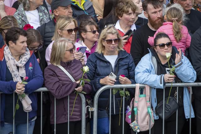 Crowds gather to watch the procession of Queen Elizabeth II's coffin from the Palace of Holyroodhouse to St Giles' Cathedral in Edinburgh. Picture: Lesley Martin - WPA Pool/Getty Images