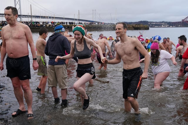 People take part in the Loony Dook New Year's Day dip in the Firth of Forth at South Queensferry,