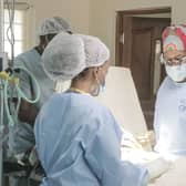 Dr Neema Kaseje (right) and a surgical team working in a KidsOR operating room.