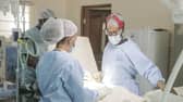 Dr Neema Kaseje (right) and a surgical team working in a KidsOR operating room.