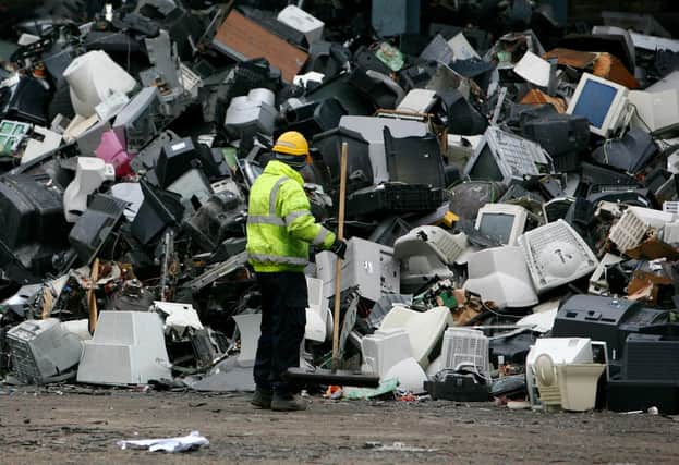 A mass of electrical equipment, including old television sets and computer monitors, awaits recycling (Picture: Gareth Fuller/PA)