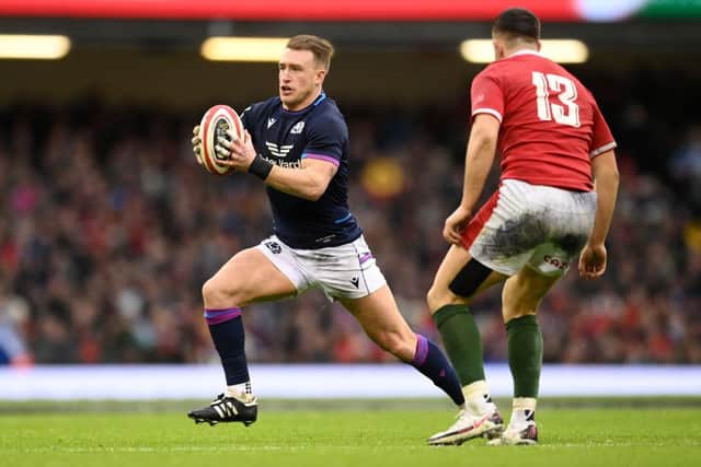 Stuart Hogg of Scotland is tackled by Owen Watkin of Wales during the Guinness Six Nations match between Wales and Scotland at Principality Stadium on February 12, 2022 in Cardiff, Wales. (Photo by Clive Mason/Getty Images)