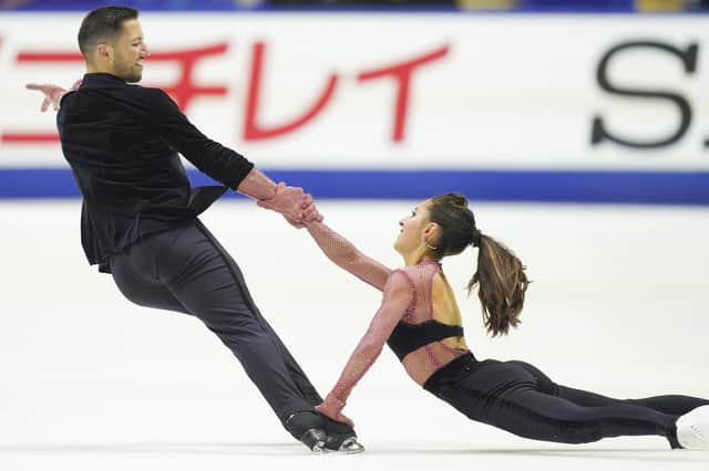 CORRECTS DATE - Lilah Fear and Lewis Gibson of Britain perform in the ice dance rhythm dance program during the ISU Grand Prix of Figure Skating - NHK Trophy in Kadoma, near Osaka, Japan. (AP Photo/Tomohiro Ohsumi)