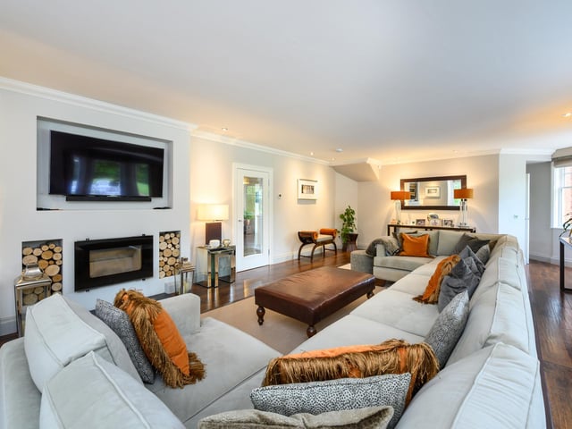 Glenfuir’s reception hall features Spanish cherry Karndean flooring, which runs throughout the ground floor, a wood-burning stove, and ornate ceiling, with plenty of light flowing from a conservatory area.
At the heart of the home is a 50-foot open-plan kitchen, dining and living area – a tastefully minimalist design take, with island and breakfast bar.