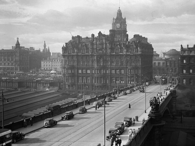 View of the North British Hotel with North Bridge in the foreground with tramlines.