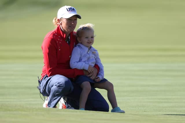 Stacy Lewis, who was an assistant captain in the match, with her daughter Chesnee during the 2021 Solheim Cup at Inverness Club in Toledo, Ohio. Picture: Gregory Shamus/Getty Images.