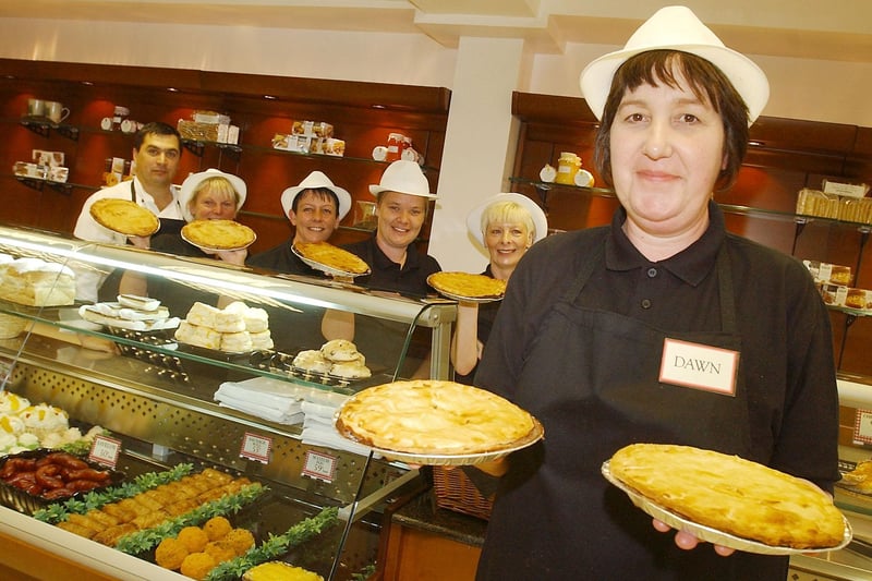 The staff of the Ambri with a selection of pies in 2008. Who do you recognise?