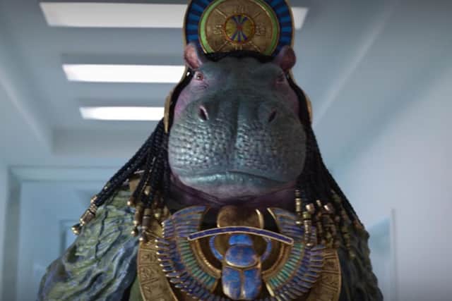 The doors swing open to reveal a hippo, walking on two legs and able to speak. Photo: Disney / Marvel.