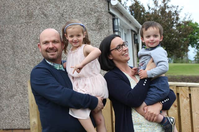 Kenny and Crystal Arnott with three-year-old Benjamin and his big sister, Lily, five in their garden Penicuik.