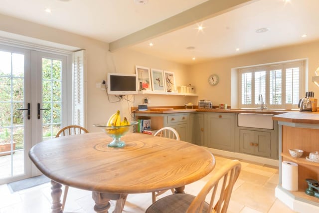 A stunning, bespoke fitted kitchen/breakfasting room, including hand crafted units with oak work surfaces.