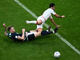 Harry Souttar puts in a crunching tackle during Australia's 1-0 win over Tunisia.