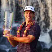 Thorbjorn Olesen poses with the Thailand Classic Trophy after storming to a four-shot success at Amata Spring Country Club. Picture: Thananuwat Srirasant/Getty Images.