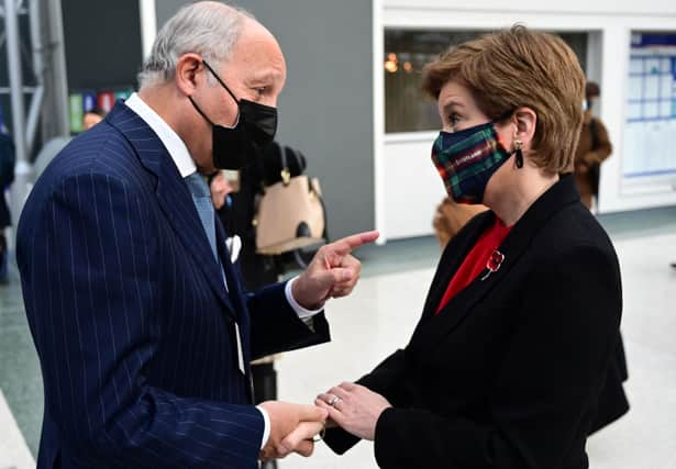 Nicola Sturgeon with former French premier and foreign minister Laurent Fabius at COP26 (Picture: Paul Ellis/AFP via Getty Images)