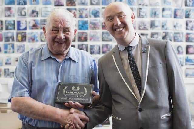 Greentrax record label founder Ian Green was presented with a special award by Simon Thoumire, founder of the Scottish music industry organisation Hands Up For Trad, in 2016 to coincide with the company's 35th anniversary. Picture: Allan MacDonald