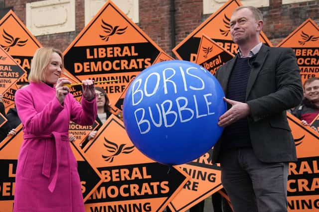 Helen Morgan, winner of the North Shropshire by-election after overturning a Conservative majority of nearly 23,000, symbolically bursts Boris Johnson's 'bubble' (Picture: Christopher Furlong/Getty Images)
