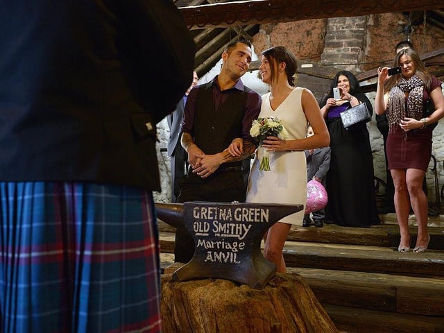 Michael Lewis and Rebecca Anderson get married at the Gretna Green Famous Blacksmiths Shop on Valentine's Day 2013.