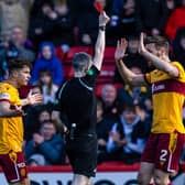 Referee Craig Napier shows Motherwell's Jack Vale a red card (not in frame) during a cinch Premiership match between Aberdeen and Motherwell at Pittodrie Stadium, on April 27, 2024, in Aberdeen, Scotland. (Photo by Craig Williamson / SNS Group)