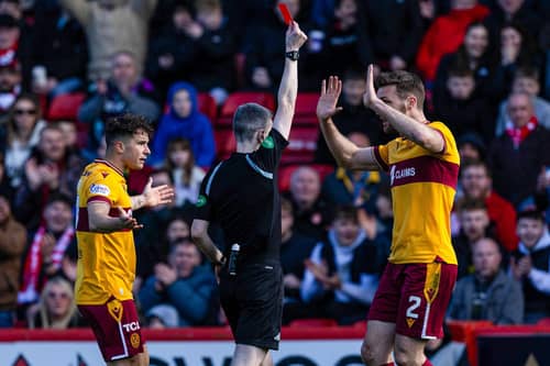 Referee Craig Napier shows Motherwell's Jack Vale a red card (not in frame) during a cinch Premiership match between Aberdeen and Motherwell at Pittodrie Stadium, on April 27, 2024, in Aberdeen, Scotland. (Photo by Craig Williamson / SNS Group)