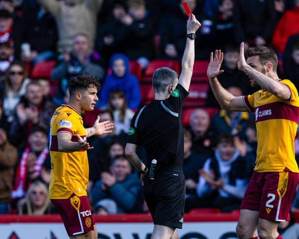 Referee Craig Napier shows Motherwell's Jack Vale a red card (not in frame) during a cinch Premiership match between Aberdeen and Motherwell at Pittodrie Stadium, on April 27, 2024, in Aberdeen, Scotland. (Photo by Craig Williamson / SNS Group)