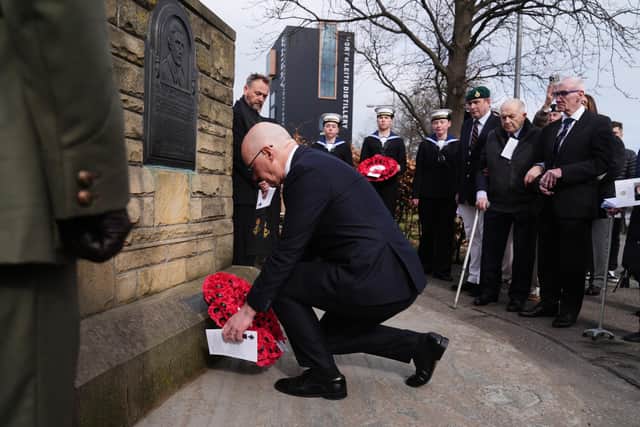 First Minister John Swinney lays a wreath to mark the sacrifice made by his uncle Thomas Peck Hunter during a Royal Marine Commandos memorial service at the Hunter Memorial in Leith, Edinburgh, yesterday (Picture: Andrew Milligan/PA Wire)