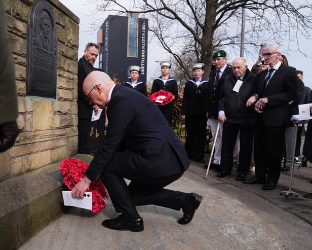 First Minister John Swinney lays a wreath to mark the sacrifice made by his uncle Thomas Peck Hunter during a Royal Marine Commandos memorial service at the Hunter Memorial in Leith, Edinburgh, yesterday (Picture: Andrew Milligan/PA Wire)