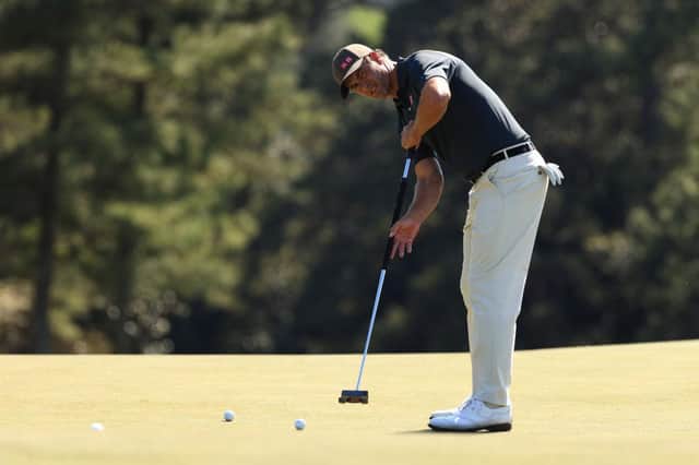 Adam Scott putts on the 18th green during a practice round prior to the Masters at Augusta National Golf Club. Picture: Mike Ehrmann/Getty Images.