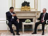 Russian President Vladimir Putin meets with China's President Xi Jinping at the Kremlin in Moscow on Monday. Picture: Sergei Karpuhkin/AFP via Getty Images)