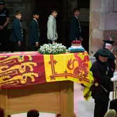Members of the public file past the coffin of Queen Elizabeth II in St Giles' Cathedral, Edinburgh, as it lies at rest. Picture date: Monday September 12, 2022.