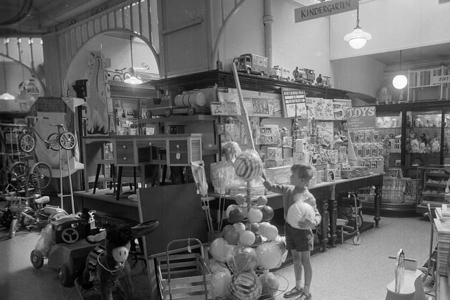 For a child in 1960s Edinburgh there was no more exciting way to spend a Saturday than to visit the Jenners Toy Department. A youngster is pictured in the shop in August 1962.
