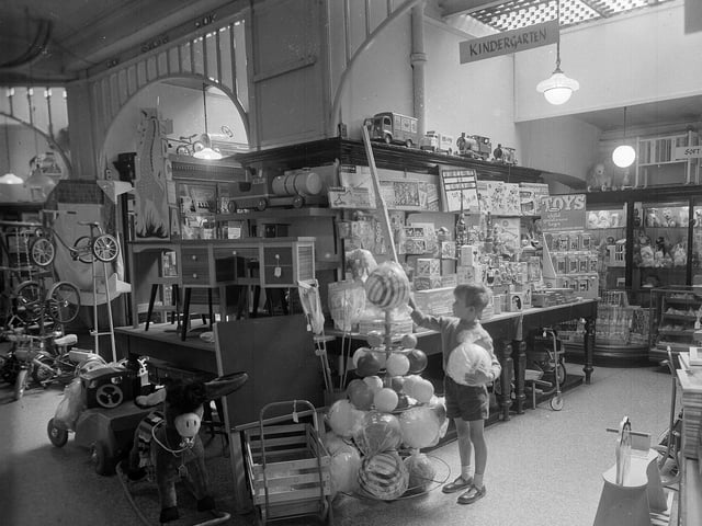 For a child in 1960s Edinburgh there was no more exciting way to spend a Saturday than to visit the Jenners Toy Department. A youngster is pictured in the shop in August 1962.