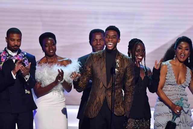 Chadwick Boseman (C), Michael B. Jordan (L), Danai Gurira (C), Lupita Nyong'o (2R), Angela Bassett (R) and the cast of "Black Panther" accept the award for best Cast In A Motion Pictureuring the 25th Annual Screen Actors Guild Awards in 2016. (Photo by FREDERIC J. BROWN/AFP via Getty Images)