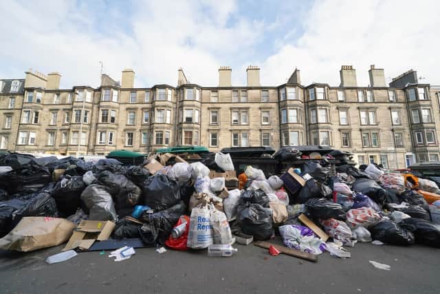 Piles of rubbish and overflowing bins on August 29, 2022, the last day of Edinburgh's bin strike. (Photo by Andrew Milligan/PA)