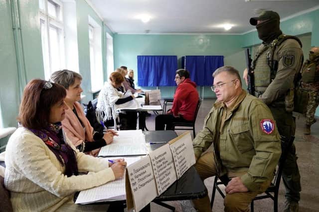 Konstantin Ivashchenko, former CEO of the Azovmash plant and appointed pro-Russian mayor of Mariupol, visits a polling station as people vote in a referendum in Mariupol.
