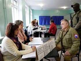 Konstantin Ivashchenko, former CEO of the Azovmash plant and appointed pro-Russian mayor of Mariupol, visits a polling station as people vote in a referendum in Mariupol.