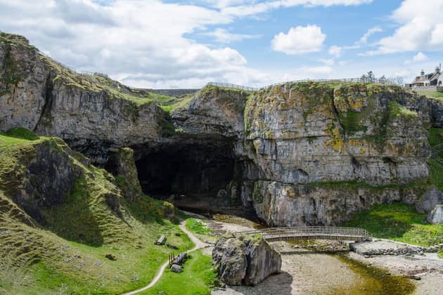 This natural sea cave is situated one mile to the East of Durness village which lies in Sutherland in the Highlands. It is thought the name “smoo” comes from the Norse word “smjugg” which refers to a hole or hiding place. In Scottish mythology, the devil himself was said to hide in the cave before one fateful encounter with the Wizard of Reay (Donald Mackay) who outfoxed him. According to Smoo Cave tours the site “is fully accessible 365 days a year public access with a walkway into the waterfall chamber, free of charge.”