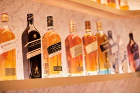 FTSE-100 spirits giant Diageo has a vast portfolio that includes Johnnie Walker whisky, pictured. The group has almost 30 malt distilleries in Scotland.
