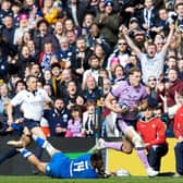 Scotland's Duhan van Der Merwe strides forward before playing the pass to Blair Kinghorn to score the last try of the match against Italy.