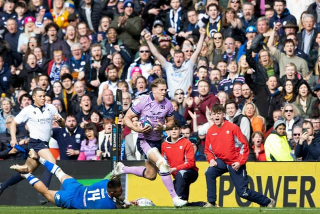 Scotland's Duhan van Der Merwe strides forward before playing the pass to Blair Kinghorn to score the last try of the match against Italy.