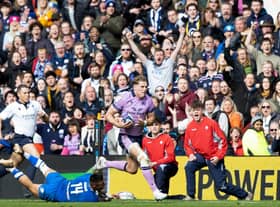 Scotland's Duhan van Der Merwe strides forward before playing the pass to Blair Kinghorn to score the last try of the match against Italy.