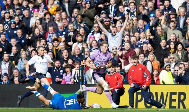 Scotland's Duhan van Der Merwe strides forward before playing the pass to Blair Kinghorn to score the last try of the match against Italy.