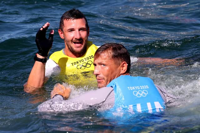 Giles Scott (top) of Team GB celebrates after winning sailing gold in the Finn class alongside silver medallist Zsombor Berecz of Hungary. Picture: Phil Walter/Getty Images