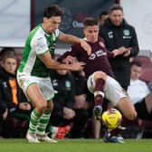 Hibs' Joe Newell and Hearts' Cammy Devlin clash during the last derby at Tynecastle.