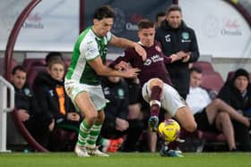 Hibs' Joe Newell and Hearts' Cammy Devlin clash during the last derby at Tynecastle.