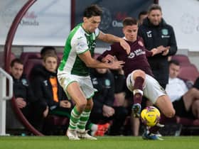 Hibs' Joe Newell and Hearts' Cammy Devlin clash during the last derby at Tynecastle.
