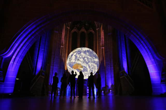 ‘Gaia’ by Luke Jerram will be one of the highlights of SPECTRA, Scotland's festival of light, which opens on Thursday in Aberdeen. It is pictured here at an earlier showing at Liverpool Cathedral and will take over the new look Aberdeen Art Gallery when it goes on show in the North East. PIC:  Gareth Jones