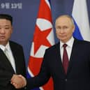 Russian President Vladimir Putin and North Korea's leader Kim Jong Un shaking hands during their meeting at the Vostochny Cosmodrome in Russia.