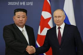 Russian President Vladimir Putin and North Korea's leader Kim Jong Un shaking hands during their meeting at the Vostochny Cosmodrome in Russia.